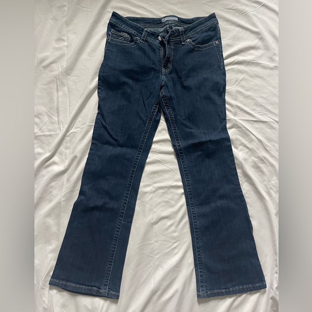 Dark wash low rise bootcut jeans with embroidery accents